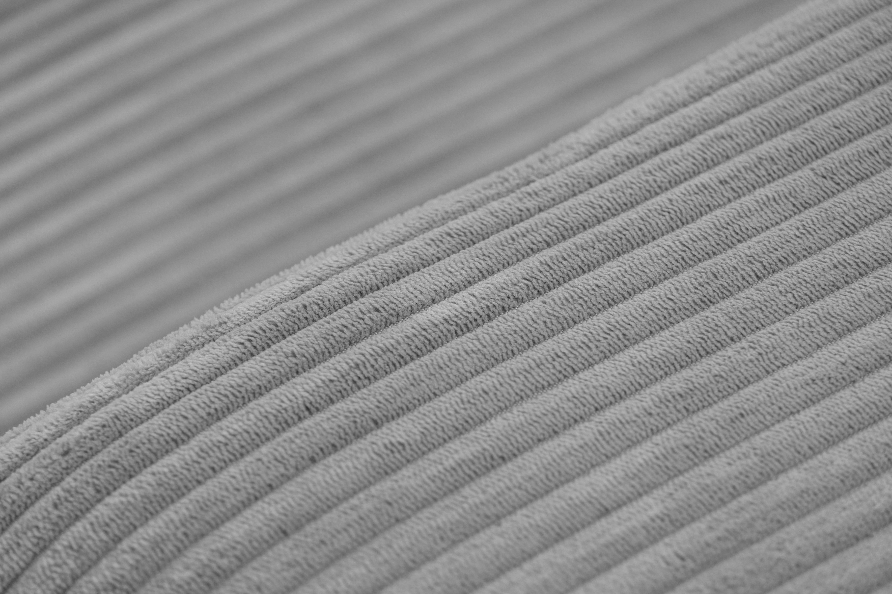 Rozkladacia rohová sedacia súprava Avia Mini univerzálna - sivý menčester Lincoln 86 Rohová sedacia súprava Avia Mini s funkciou spánku uniwersalny prawo/Ľavá strana - šedý MENČESTER Lincoln 86