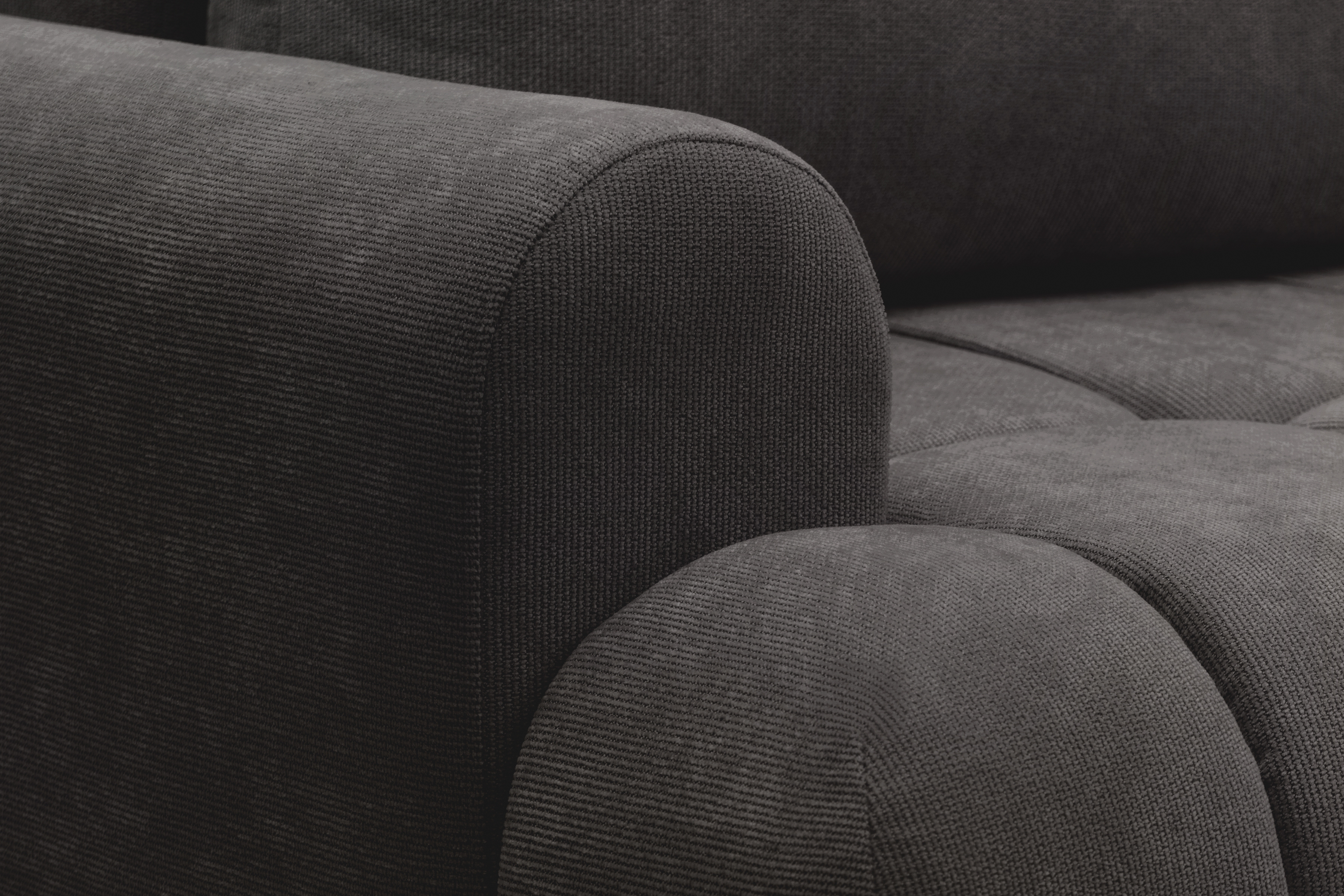 Rohová sedacia súprava Lutario L pravá s funkciou spania - tmavosivá hydrofóbna pletená látka Venice 2021 Rohová sedacia súprava Lutario L s funkciou spánku pravá strana - ciemnoszara plecionka hydrofobowa Venice 2021