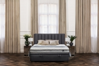 Posteľ do spálne s čalúneným roštom a úložným priestorom Misel - 160x200 posteľ čalouněné z wysokim wezglowiem s prešívaním 