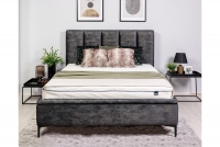 Posteľ do spálne s čalúneným roštom a úložným priestorom Klabi - 160x200, Nohy čierny  šedá posteľ z wysokimi nozkami 