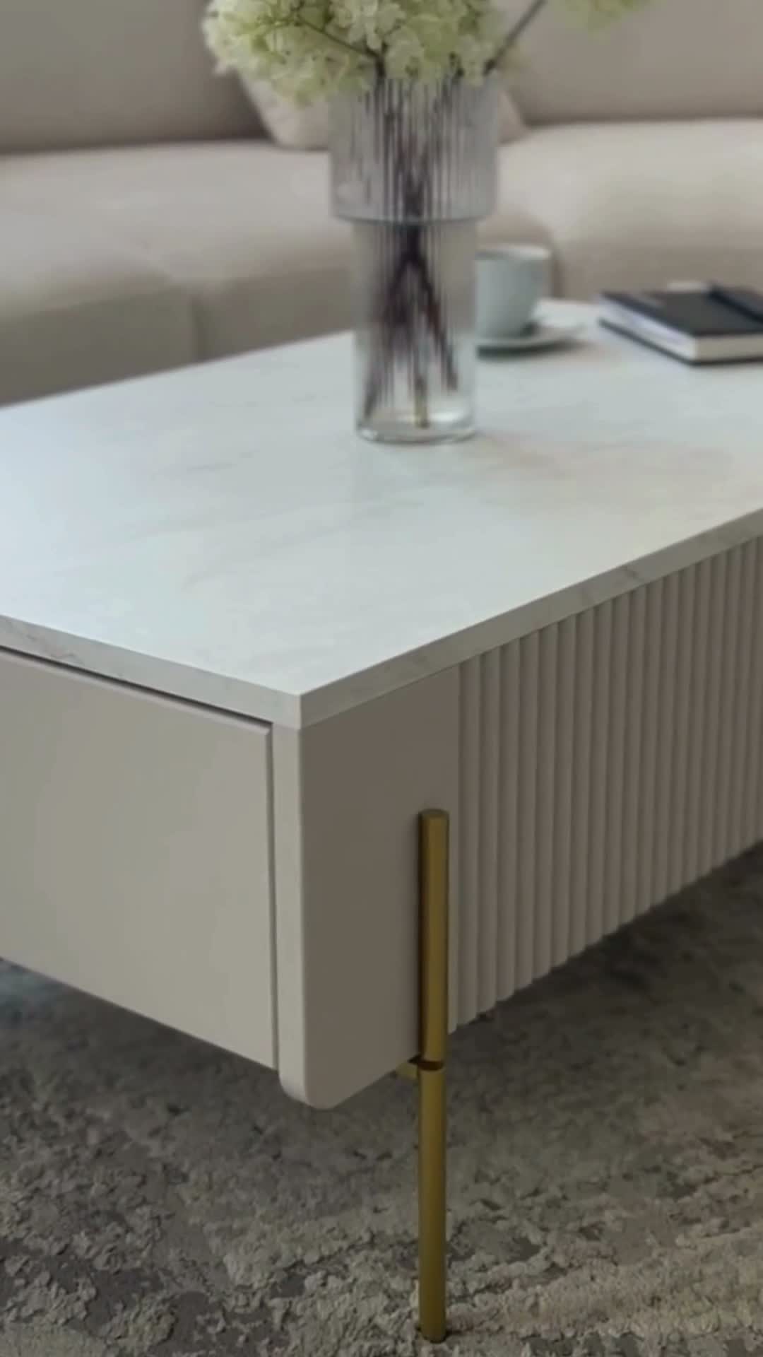 Konferenčný stolík Malmi 100 cm - kašmírová / zlatá Stolík kawowy so zásuvkami Malmi 100 cm - kašmír / zlote nozki